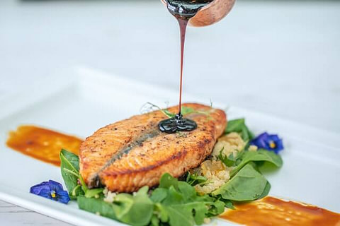 salmon on plate with salad
