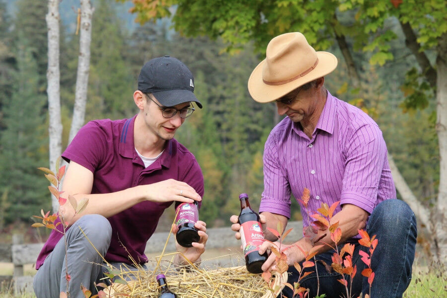 Jonas and Joerg Seidel from J&J Aronia with Aronia juice bottles